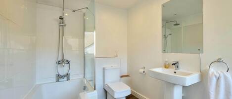 Shower, hair dryer, towels, shampoo