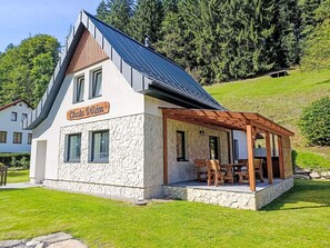 A two-story building with a stone facade and a sloped roof. - Stunning private villa for 12 guests with WIFI, hot tub, patio, pets allowed and panoramic view (Dvůr Králové Nad Labem)