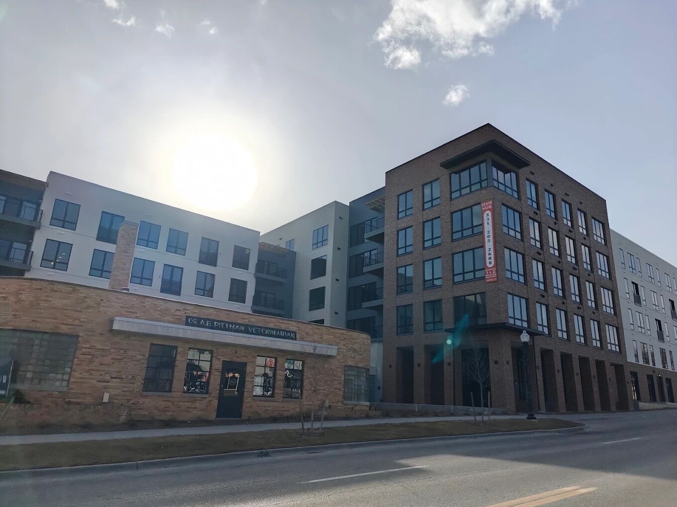 A multi-story building with a sign for Dr. A.B. Pittman Veterinary.