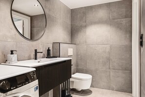 Shower, hair dryer, towels, shampoo