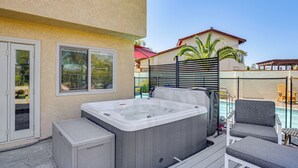 A hot tub on a patio with a pool, outdoor furniture, and a house in the background. - Hot Tub, Pool & Socal Sunsets: San Diego Area Home (Spring Valley)