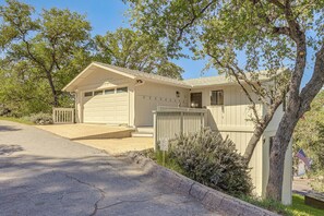 A single-story house with a garage, a front porch, and a small front yard.