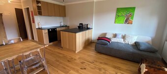 Newly renovated vacation rental in Flims X Laax with a balcony, underground parking, indoor pool, and sauna