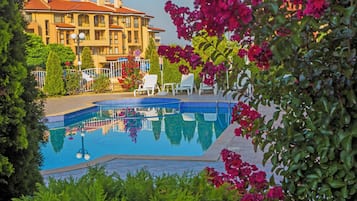 Seasonal outdoor pool, open 8:00 AM to 9:00 PM, pool umbrellas
