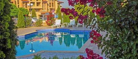 Seasonal outdoor pool, open 8:00 AM to 9:00 PM, pool umbrellas
