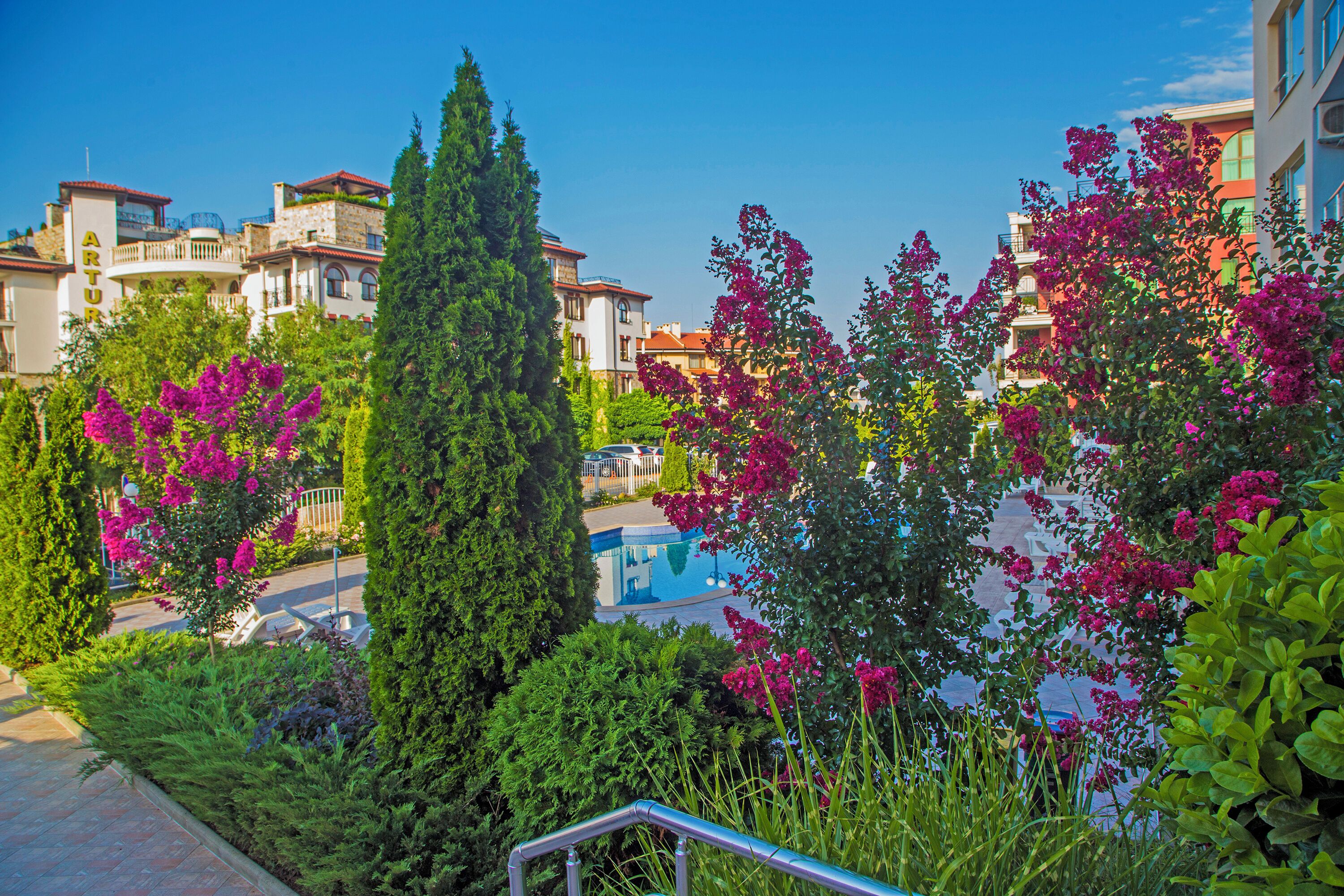 Seasonal outdoor pool, open 8:00 AM to 9:00 PM, pool umbrellas