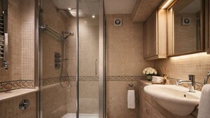 A bathroom with a glass shower enclosure, a sink with a mirror, and a towel rack. - Marylebone High Ceiling Private Spacious W1 Home - Luxurylondonstays (London)
