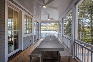 Outdoor dining - SUNAPEE LAKEFRONT! New 6-Bedroom Lake House, deepwater dock 180 ft. of shoreline (Newbury)