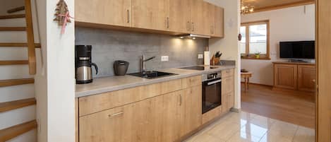 Fridge, stovetop, dishwasher, coffee/tea maker