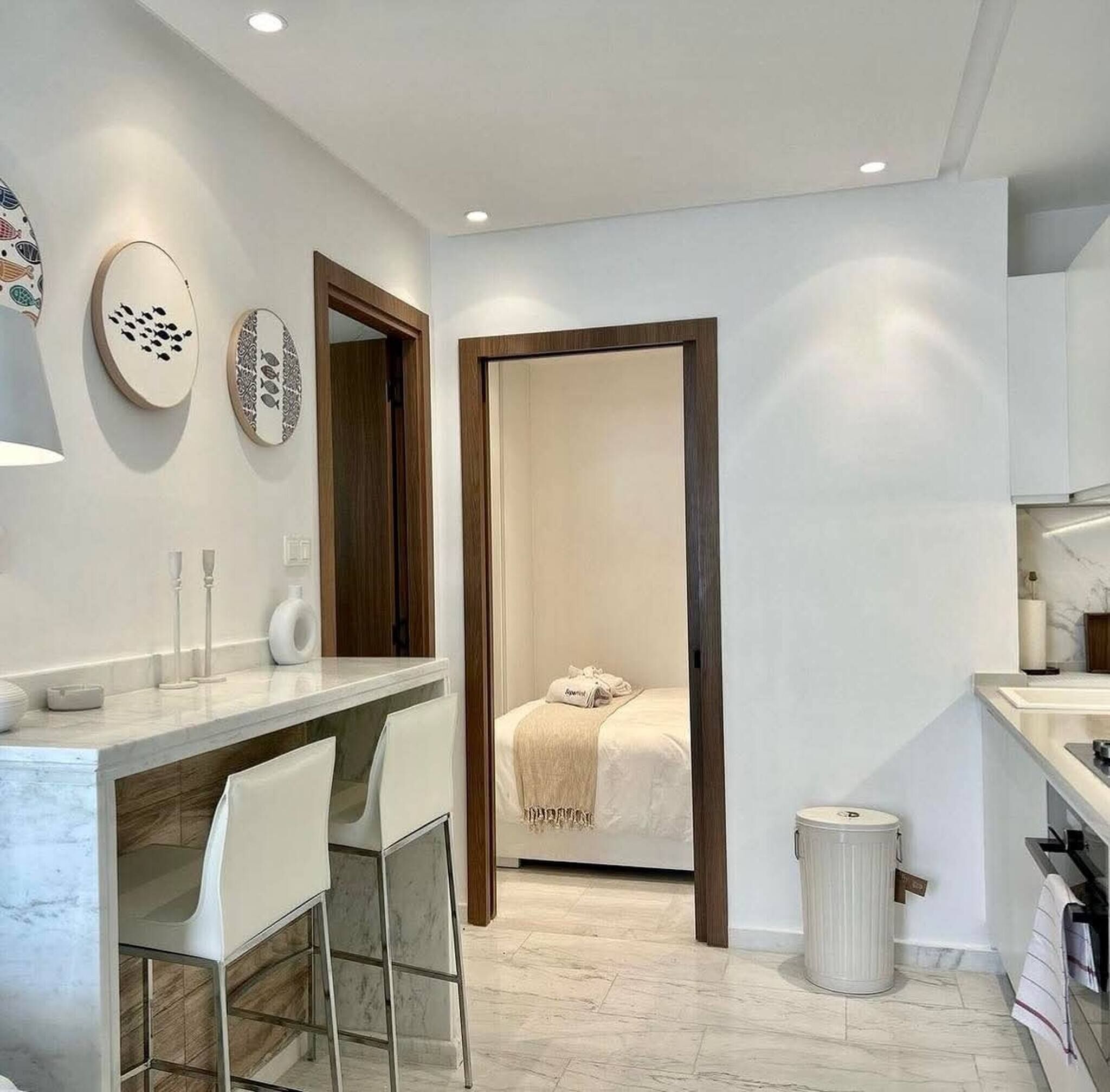 A modern bathroom with a shower, toilet, and sink.