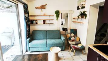 Apartamento família, varanda | Área de estar