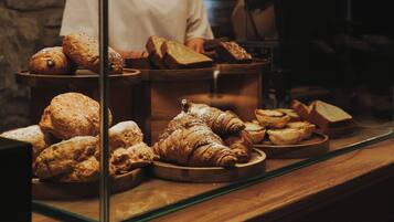 A bakery display with various baked goods.