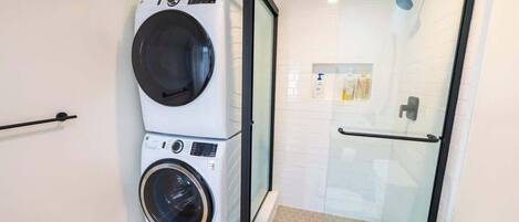 Shower, hair dryer, towels, shampoo