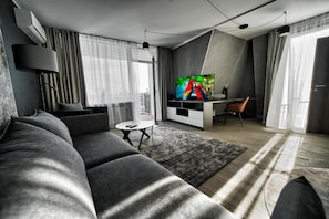 Superior Apartment, 1 Queen Bed with Sofa bed, Air conditioning, City View | Living area | 55-inch Smart TV with digital channels - Modern central Apt with AC parking gym (Riga)