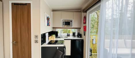 Fridge, microwave, toaster, cookware/dishes/utensils