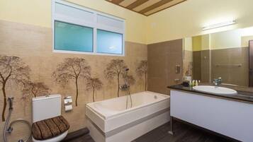 Separate tub and shower, towels, soap, shampoo