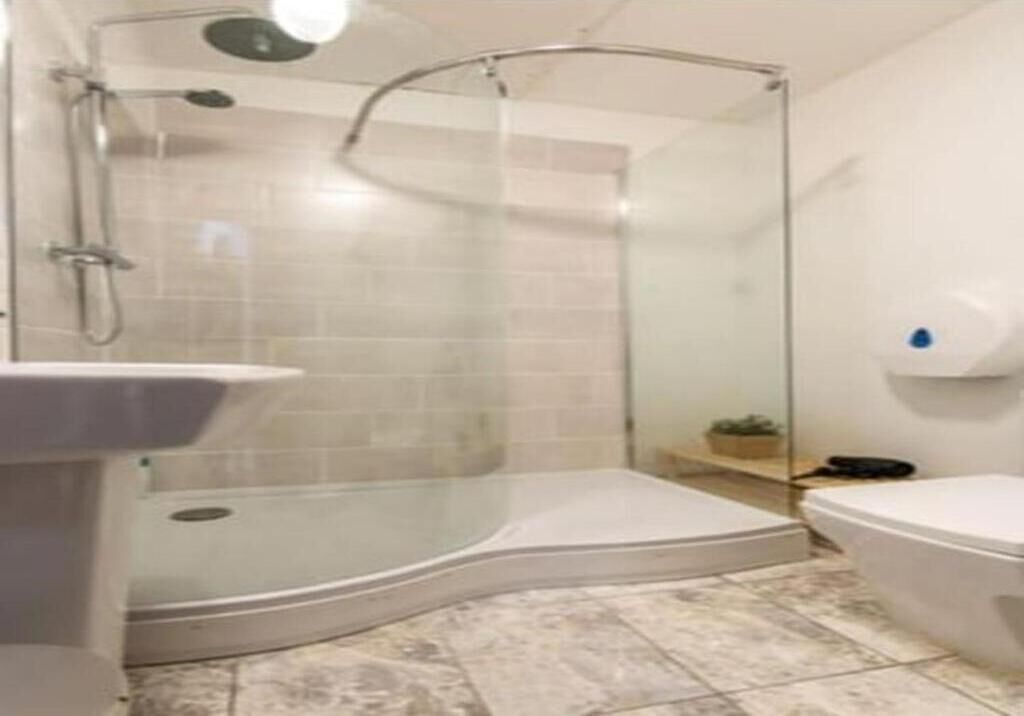Shower, hair dryer, towels, toilet paper