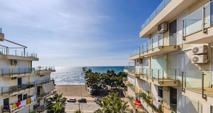 Beachfront Apartment with Pool Access by PikHost