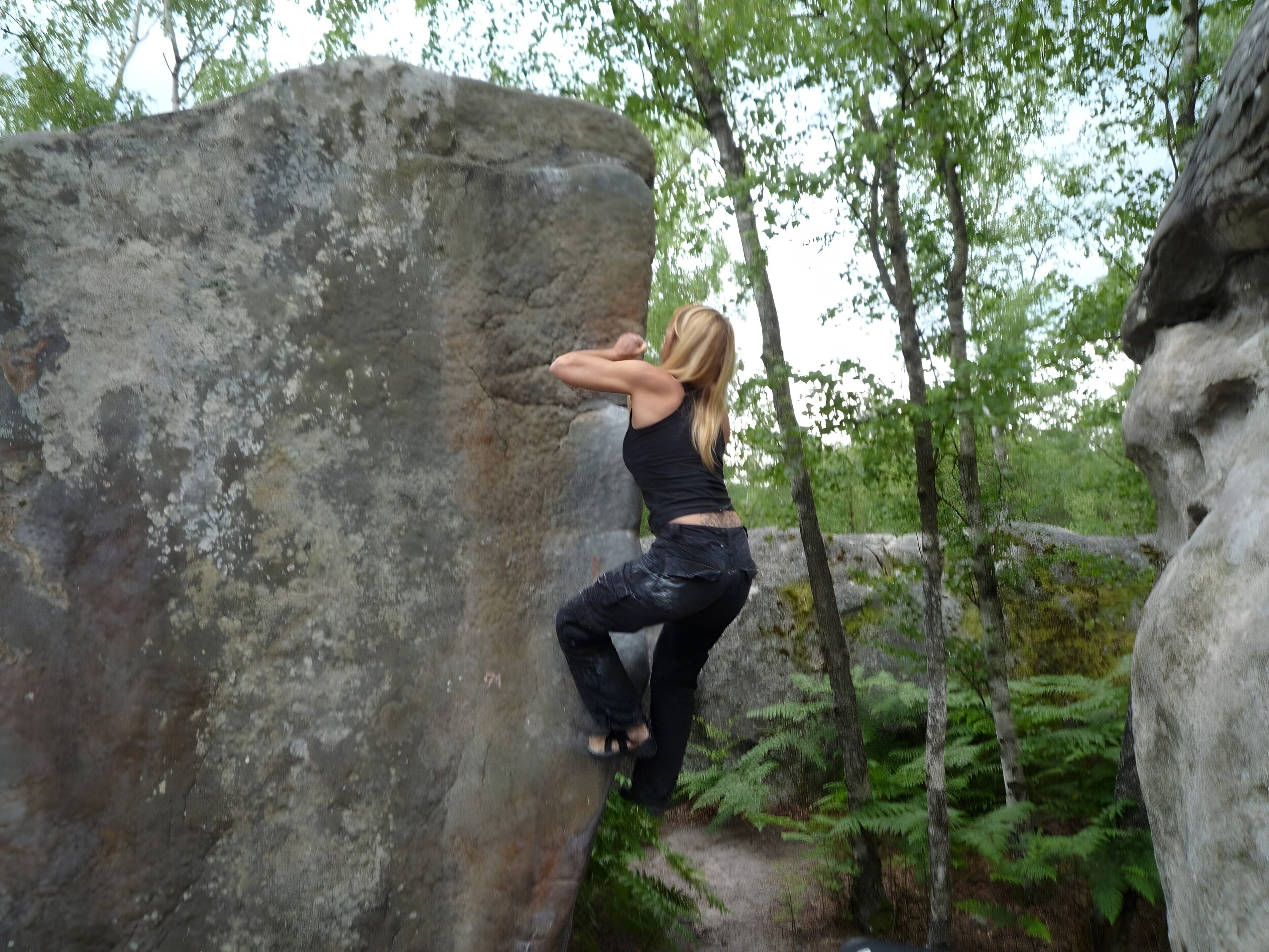A person climbing a rock.