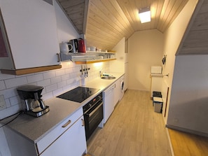 Comfort Apartment, 2 Bedrooms, Balcony, Courtyard View | Private kitchen | Dining tables