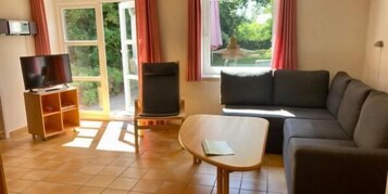 Apartamento estándar, 2 camas individuales, cocina, vistas al jardín | Zona de estar