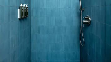 Shower, hair dryer, towels, shampoo
