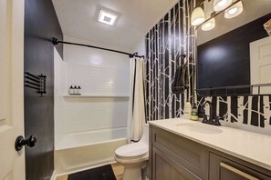 Shower, hair dryer, towels, shampoo