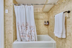Shower, hair dryer, towels, shampoo