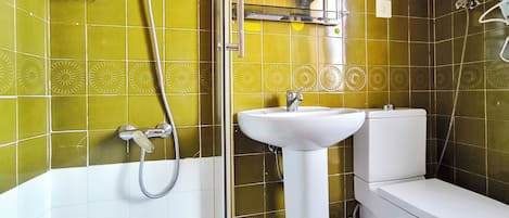 Shower, hair dryer, towels, toilet paper
