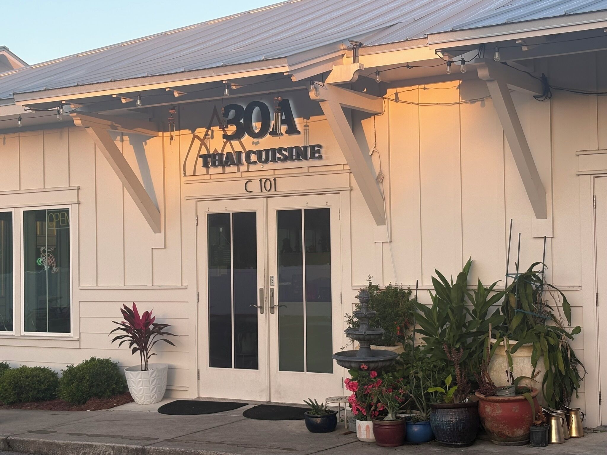 A building with a sign reading 'BOA Thai Cuisine' and the address 'C 101'.
