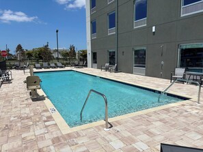 Outdoor pool - HomeTowne Studios by Red Roof Fort Myers (Fort Myers)