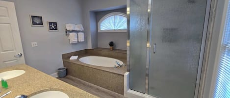 Shower, hair dryer, towels, shampoo
