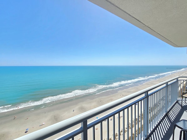 A balcony with a view of a beach and ocean. - Stay at the top of the world with Penthouse level views! 3BR\Bath Oceanfront (Myrtle Beach)