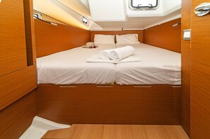 A compact, well-lit cabin with a single bed, a small window, and wooden paneling. - Sun-Kissed Sailing Adventure in the Sporades Islands from Volos, Thessaly (Volos)