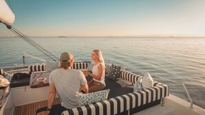 A couple on a boat with a view of the sea. - Sun-Kissed Sailing Adventure in the Saronic Islands (Palaio Faliro)