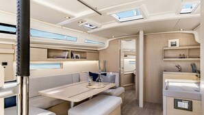 A modern interior with a dining area, seating, and built-in storage.