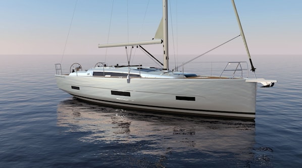 A large, sleek sailboat with a streamlined hull and a cabin deck, floating on calm water.