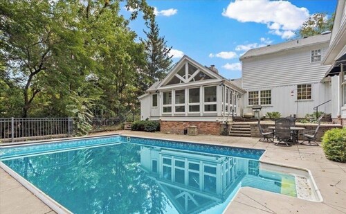 Massive 6 bedroom home, featuring an in-ground pool, located near restaurants.