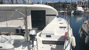 A yacht docked at a marina with the name 'NYAMI NYAMI' on its side. - Sun-Kissed Sailing Adventure in the Ionian Islands, Lefkada (Lefkada)