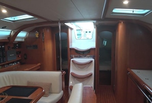 A yacht interior with a control panel, a seating area, and a sunroof. - Sun-Kissed Sailing Adventure in the Ionian Islands, Lefkada (Lefkada)
