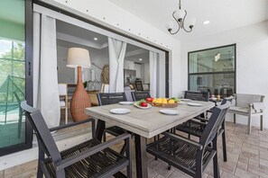 Outdoor dining - Mimosa Days and Game Nights Heated Pool Home (Cape Coral)