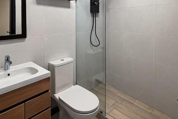 Shower, towels, soap, toilet paper