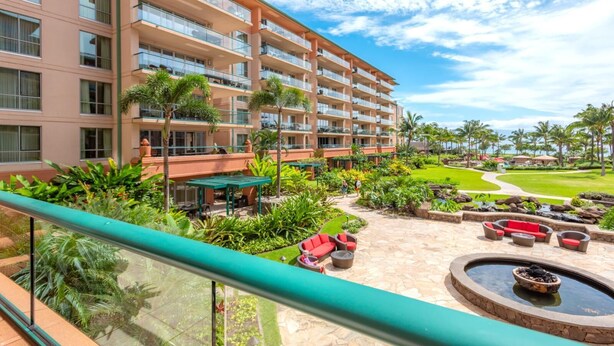 A hotel with multiple floors, outdoor seating, and a well-maintained garden. - Honua Kai 3 Free Cars KBM Resorts Front Alii Suite 3 Units, 6 Bedrooms HK Ml-3146 (Kaanapali)