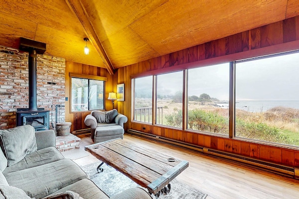 Cozy up by the wood-burning fireplace, where the ocean views invite you to unwind and create lasting memories.