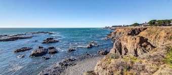 Blufftop home with private hot tub & ocean views, dogs welcome