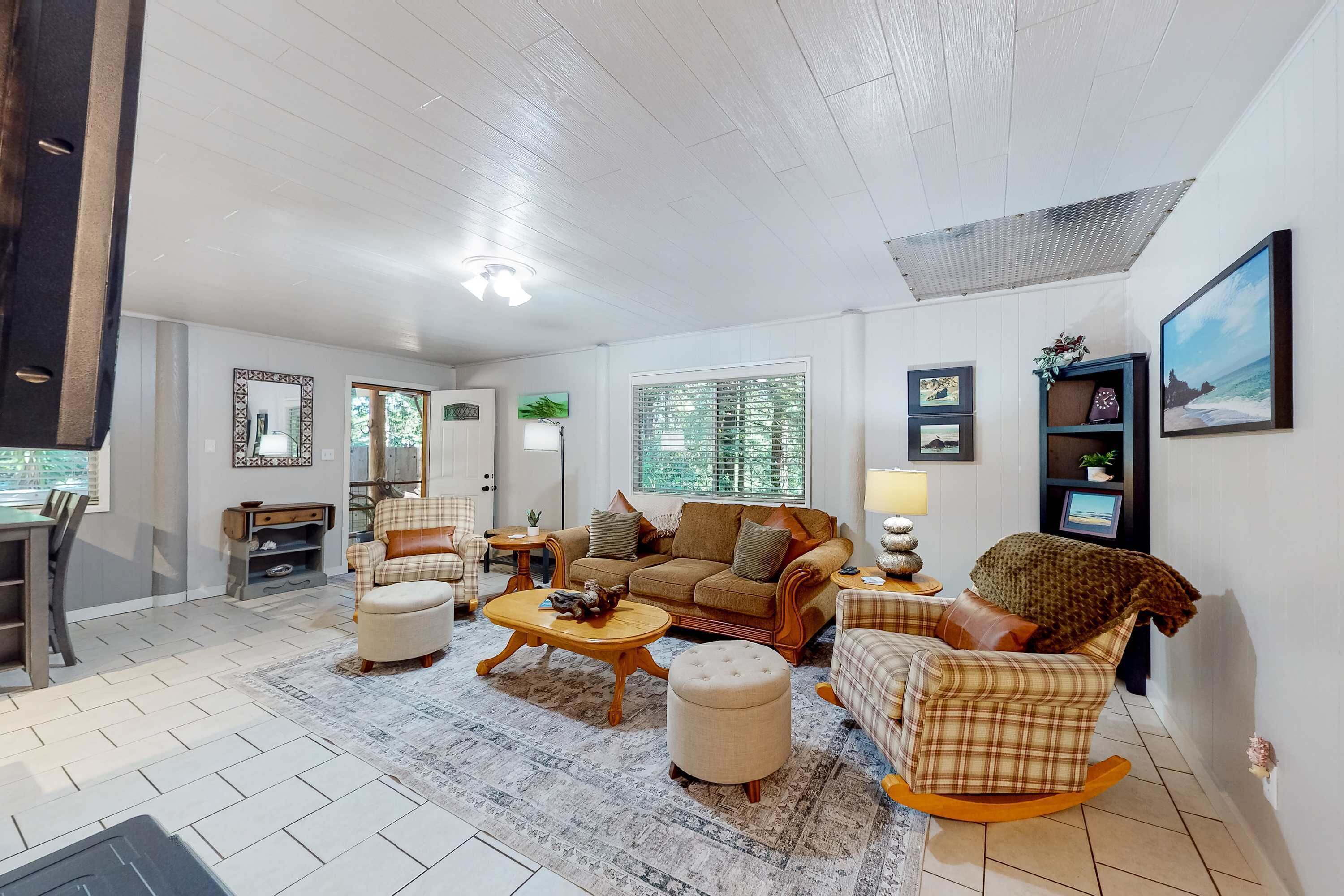The perfect spot for family gatherings, this living area blends comfort with a touch of rustic charm.