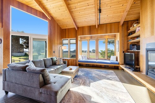 Ocean-view meadow home with hot tub near Walk On Beach, dogs welcome