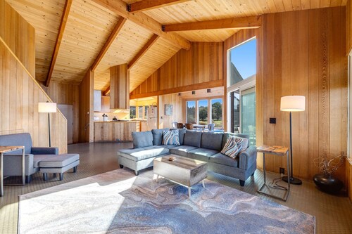 Ocean-view meadow home with hot tub near Walk On Beach, dogs welcome