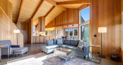 Ocean-view meadow home with hot tub near Walk On Beach, dogs welcome