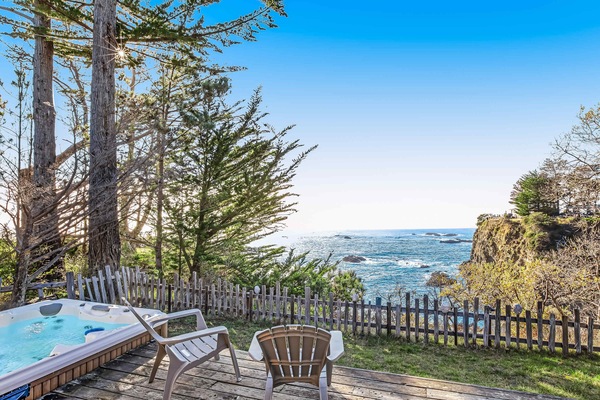 Nestled among the trees, your private hot tub offers a tranquil escape, where you can unwind while gazing at the stunning ocean scenery.